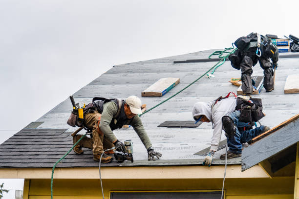 Professional Storm Damage Roof Repair technician working in Brooklyn, IN